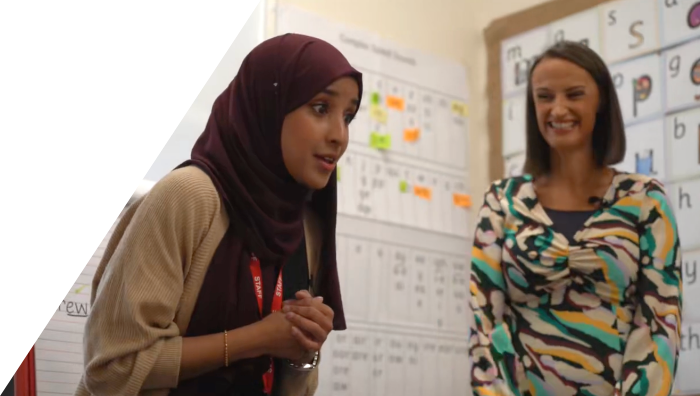 Image of a trainers coaching a teacher on an in school development day